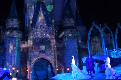 Elsa lighting the Cinderella Castle during the Frozen Christmas Show