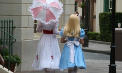 Mary Poppins and Alice walking though Epcot